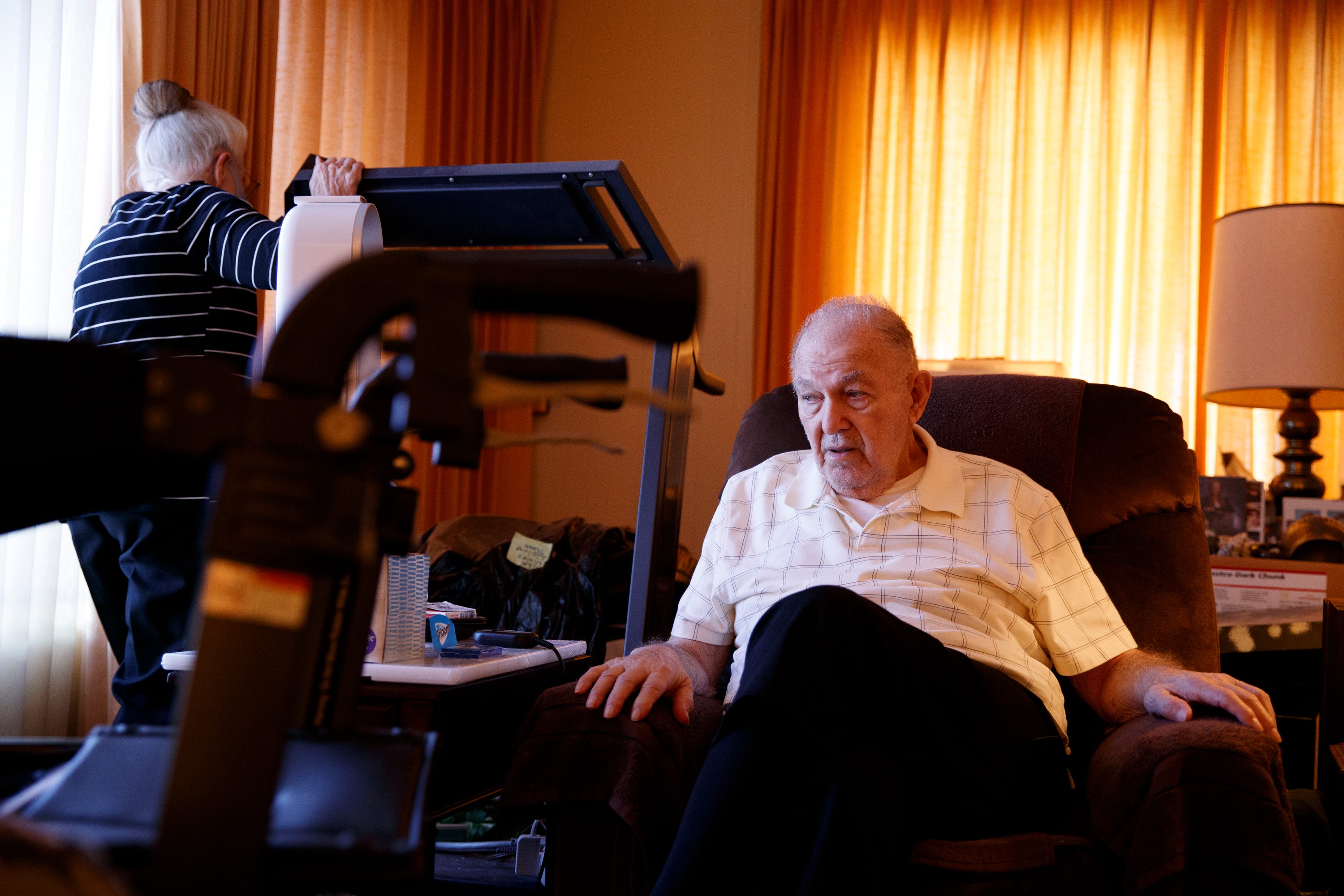 Former Green Bay Packers player Camillo Capuzzi, 89, rests inside his Fallbook, Calif., home along with his wife, Dolores Capuzzi, left, in March. "It sounds to me that the NFL is waiting for him to die," said Pat Tighe, an attorney who represents hundreds of players. Camillo Capuzzi died in April.