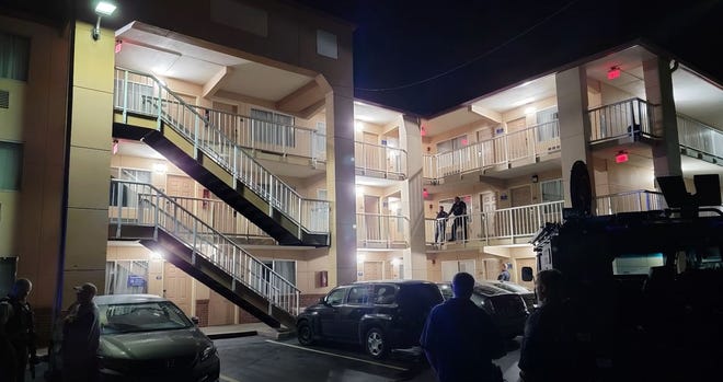 Nashville police stand on the balcony of a Percy Priest Drive hotel, where a man was fatally shot by officers are a shootout.