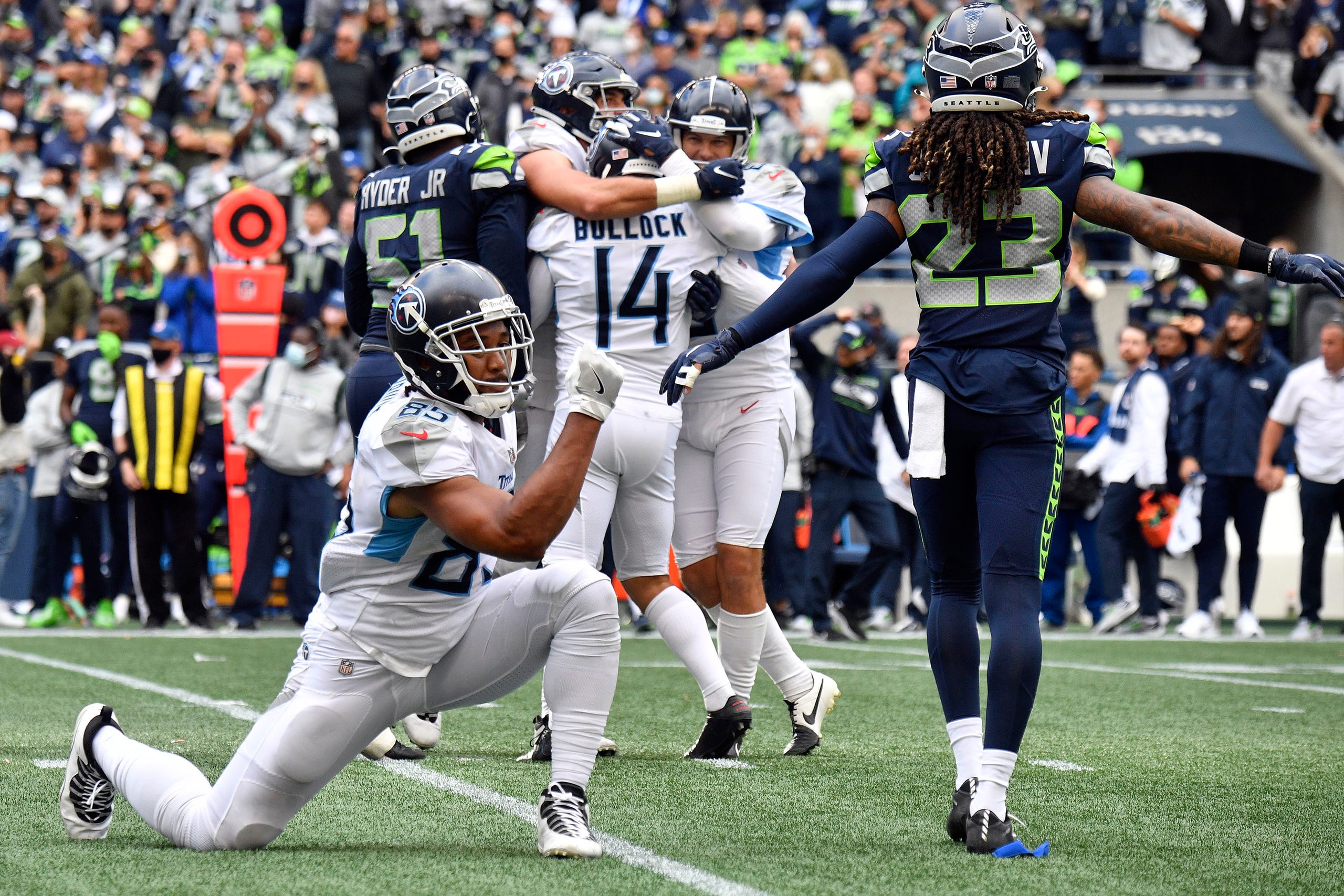 Tennessee Titans tight end MyCole Pruitt (85) celebrates kicker Randy Bullock's (14) kick that won the game in overtime at Lumen Field Sunday, Sept. 19, 2021 in Seattle, Wash.