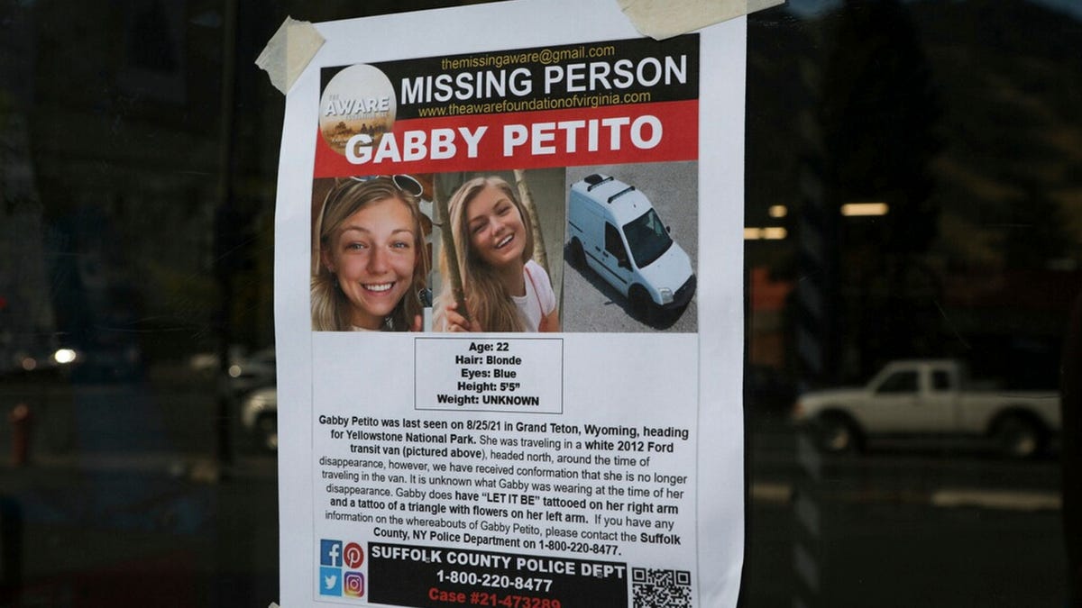 This Thursday, Sept. 16, 2021, photo, shows a Suffolk County Police Department missing person poster for Gabby Petito posted in Jakson, Wyo. Petito, 22, vanished while on a cross-country trip in a converted camper van with her boyfriend.