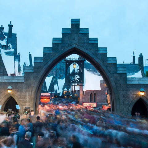 Fans rush to enter the "Wizarding World of Harry P