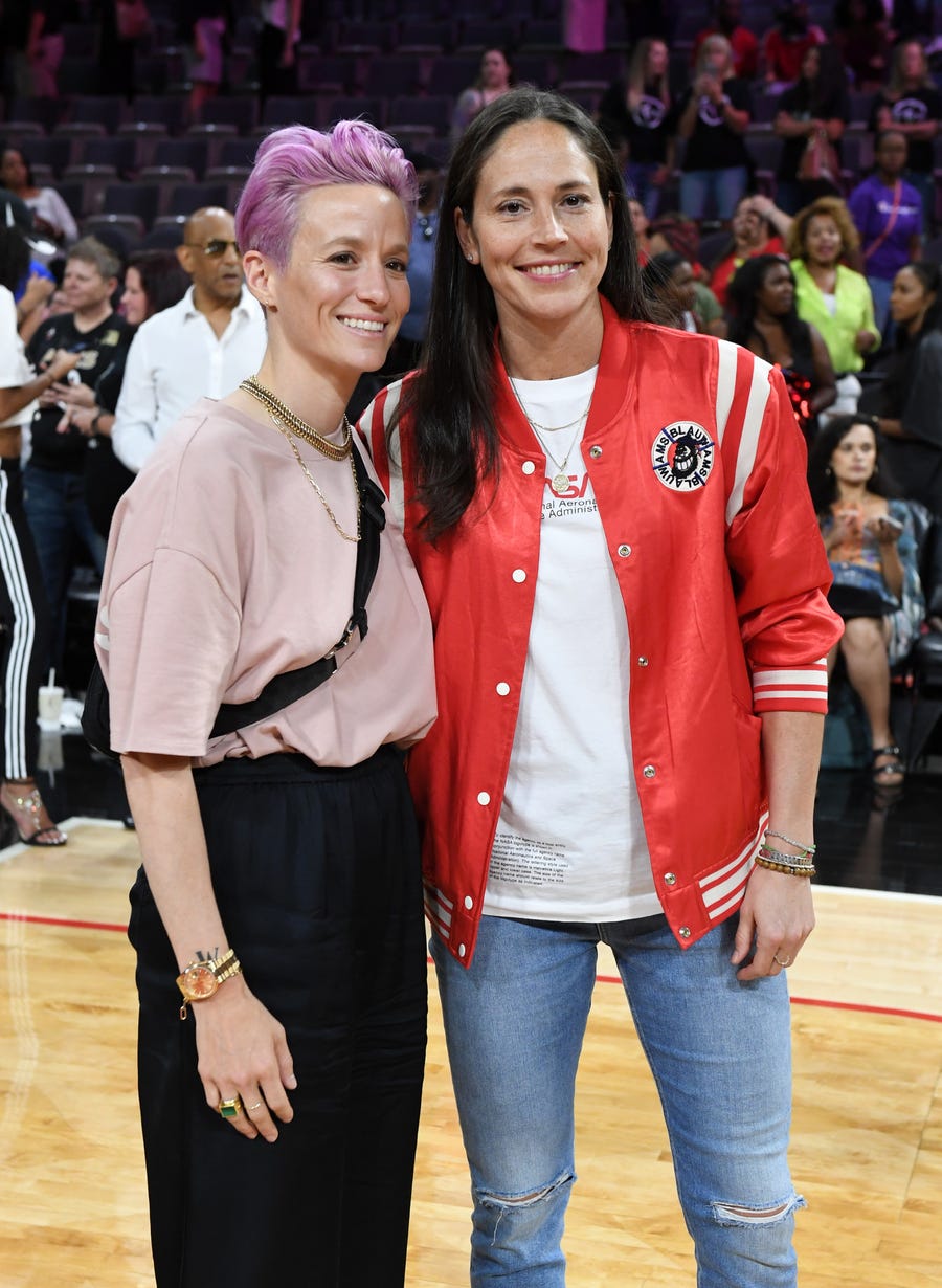 Megan Rapinoe, left, and Sue Bird are among the hundreds of athletes who signed on to an amicus brief calling on the Supreme Court to reject a Mississippi abortion law.