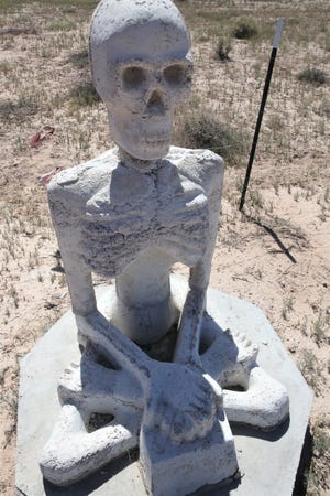 A statue that is part of an open-space art installation entitled "Siddhartha is Dead" sits on private land in Luna County, New Mexico on Monday, Sept. 20, 2021.
