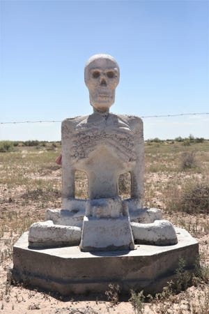 A statue that is part of a private art installation entitled "Siddhartha is Dead" sits on private land in Luna County, New Mexico on Monday, Sept. 20, 2021.