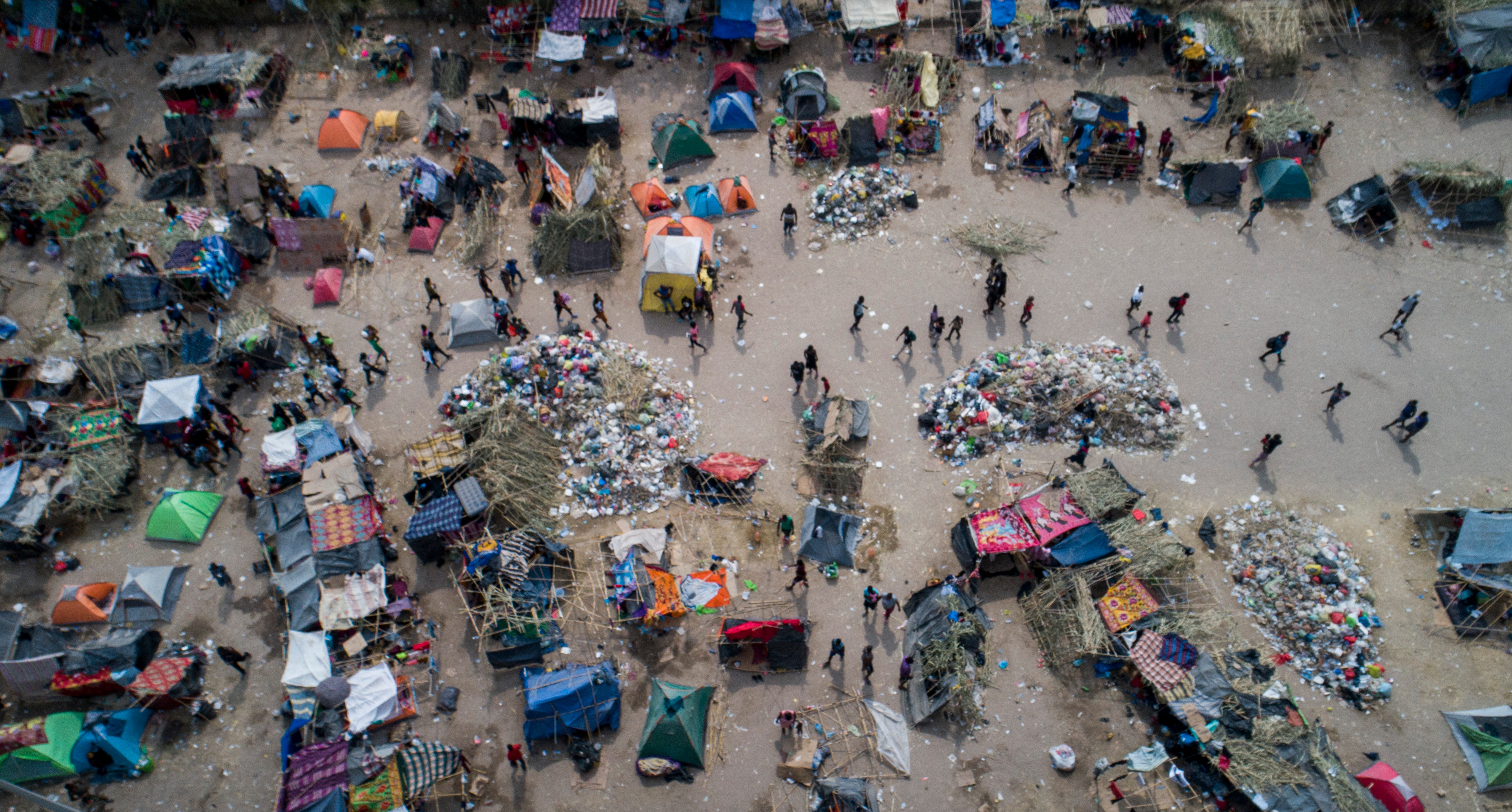 The migrant camp in Del Rio, Texas, thinned out as migrants returned to Mexico or were expelled by the U.S., as seen in these drone photos taken Tuesday, Sept. 21, 2021.