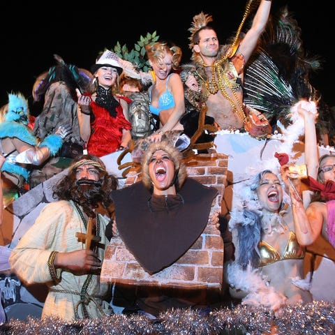 Costumed performers celebrate in the annual Villag