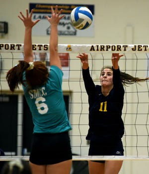 Lauren Pitock of Airport attempts to tip the ball over Colleen Castiglione of SMCC  Wednesday, September 22, 2021 in the 7th Annual Teal Attack Match at Airport High School.