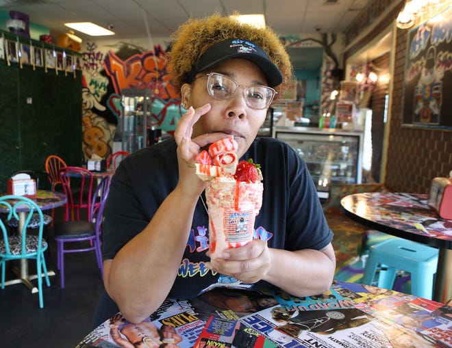 Lafesa Johnson, owner of Hip Hop Sweet Shop, with one of her creations, a milkshake with strawberry cheesecake.