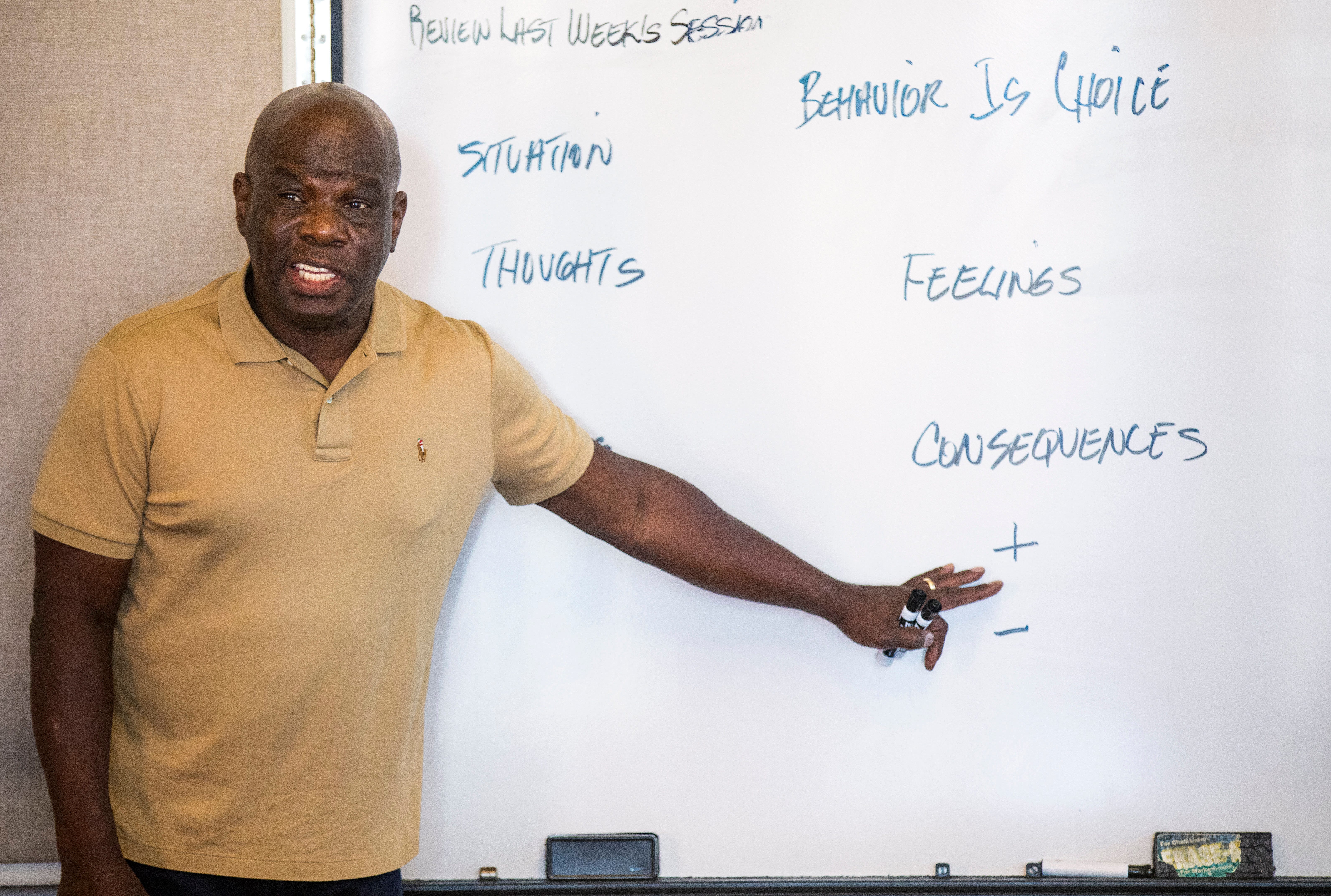 Richard Byes, a YWCA facilitator, leads a class for men who have been court-appointed to participate in a 20-week Transform class for domestic violence offenders on Aug. 26, 2021.