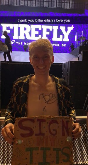 Matthew Morgan had his chest signed by Billie Eilish during her Firefly opening night set.