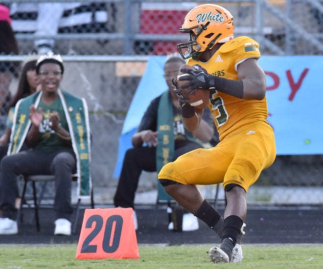 Ed White safety Davaughn Patterson intercepts a pass against Atlantic Coast in high school football in September 2021.