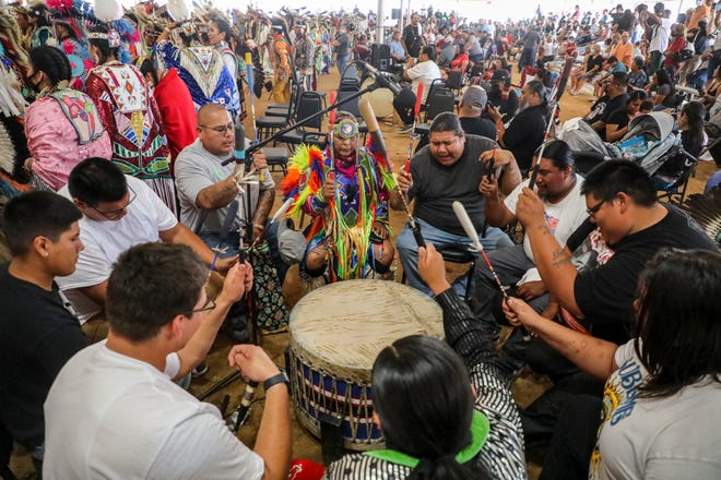 The Whitetail Boyz drum circle performs a battle victory song during the grand entry ceremony of the Morongo Thunder & Lightning Powwow, Saturday, Sept. 25, 2021, in Cabazon, Calif. 