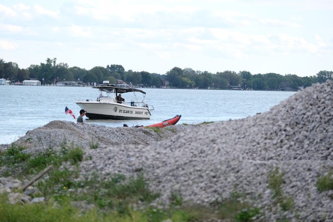 A St. Clair County Sheriff boat searches the St. Clair River where it meets the Belle River Saturday, Sept. 25, 2021, in Marine City.