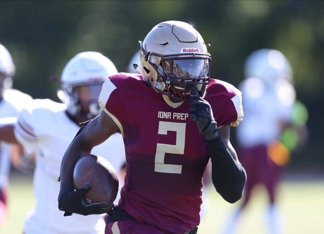 Iona Prep's Ellis Robinson IV (2) runs an interception back for a touchdown during football action against Christ the King at Iona Prep High School, on Saturday, September 25, 2021. 