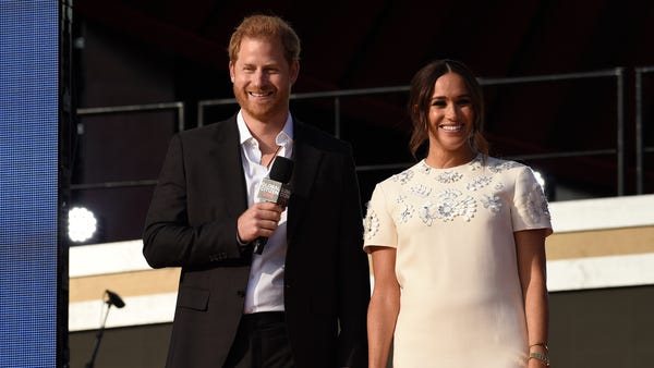 Prince Harry, the Duke of Sussex, left, and Meghan
