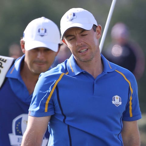 Europe's Rory McIlroy reacts to a missed putt duri