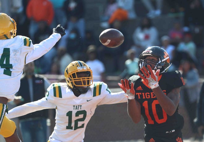 Withrow wide receiver Timothy Pope (10) tries to catch a pass in front of Taft defenders Quinton Price (12) and Keyandre Larry (4) during their football game, Saturday, Sept. 25, 2021. Price has added offers since the end of the season and has visited Cincinnati and Ohio State.
