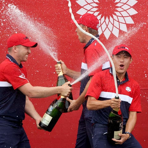 Team USA players celebrate with champagne during t
