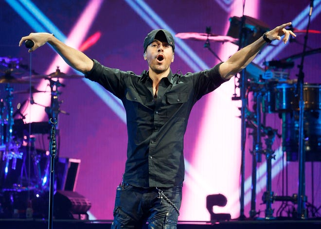 Enrique Iglesias (pictured) and Ricky Martin performed in separate sets, but the stars appeared together in the show's finale to enjoy the fans.