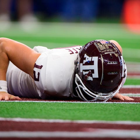 Texas A&M safety Connor Choate  falls into the end