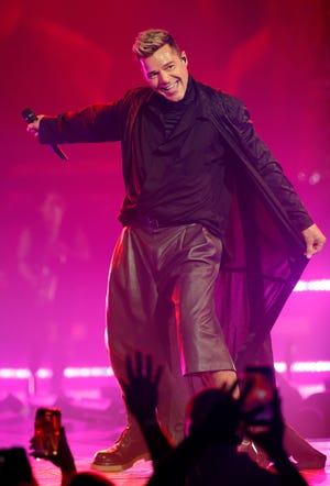 Ricky Martin beams to the crowd as he opens his Las Vegas tour with Enrique Iglesias.