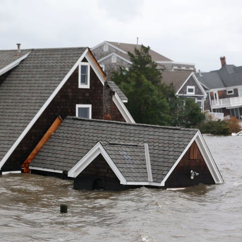 Floodwaters surround homes near the Mantoloking Br