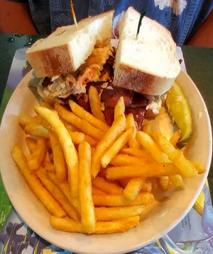 The Mayor Sandwich featured three different kinds of meat, coleslaw and fries on thick Italian bread.