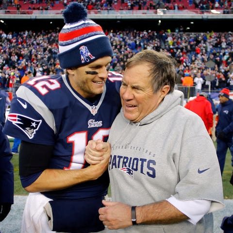 Tom Brady celebrates with Bill Belichick after one