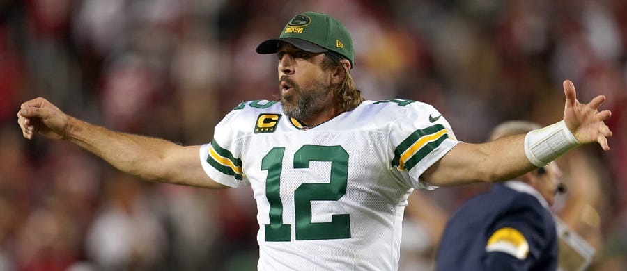 Aaron Rodgers celebrates after Mason Crosby kicked the winning field goal against the 49ers.