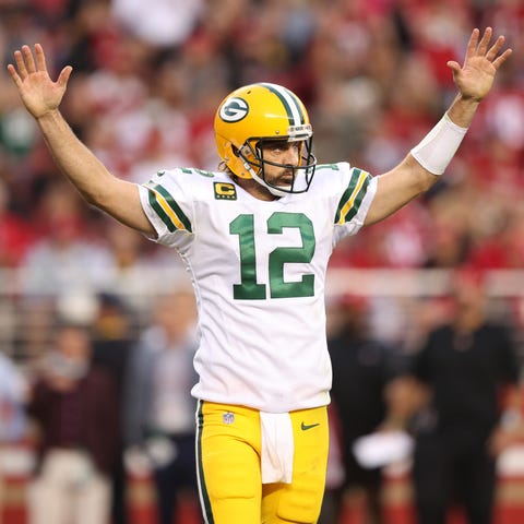 Aaron Rodgers #12 of the Green Bay Packers celebra