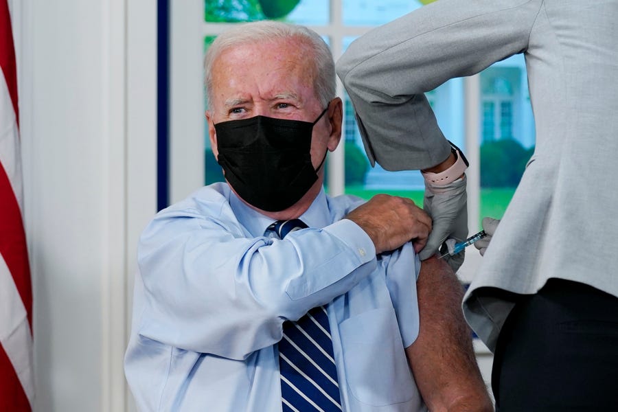 President Joe Biden receives a COVID-19 booster shot in the South Court Auditorium on the White House campus Sept. 27 in Washington.