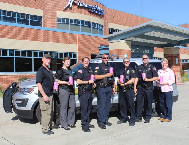 The Geneseo Police Department is offering pink tumblers for sale to create Breast Cancer Awareness and is coordinating their efforts with the Hammond-Henry Hospital Foundation to raise funds for the Hospital’s Imaging Department. In the photo showing the tumblers are, from left, Lee Calabria of Krios Engraving; Jessica Damewood, Officer Amber Berthoud, Sgt. Jameson Weisser, Officer Jamie Shoemaker; Police Chief Casey Disterhoft; and Darcy Hepner, Hammond-Henry Hospital Foundation Manager.