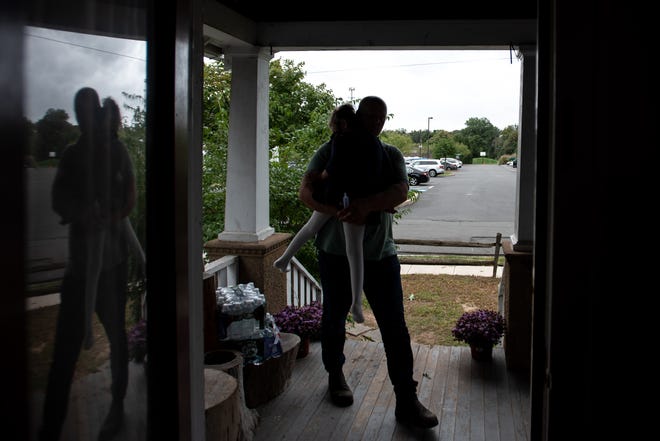 Dolph Geurds tries to comfort his daughter Kinsley Geurds, 7, in their Pennington, N.J., home on September 23, 2021.