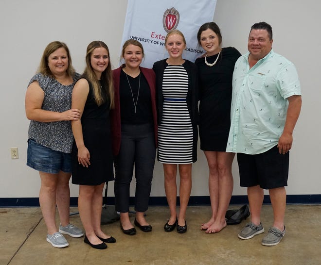 Members of the international competition-bound Manitowoc County 4-H dairy cattle judging team include (left to right): co-coach Angie Ulness, Clarissa Ulness, Emma Vos, Jenna Gries, Lauren Siemers and co-coach Paul Siemers.  The team won national honors this week at World Dairy Expo.
