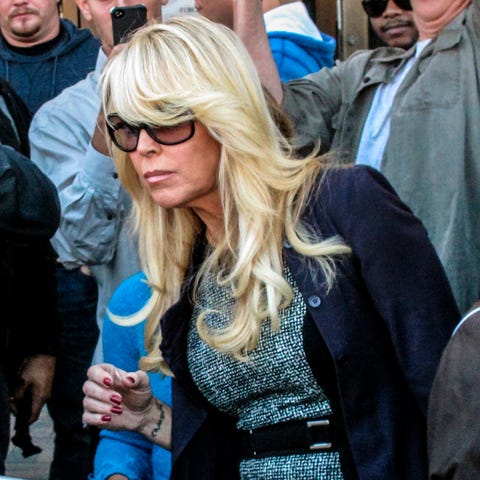 Dina Lohan leaves court on Sept. 24, 2013, in Hemp