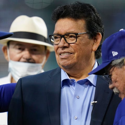 Fernando Valenzuela is greeted during a ceremony h