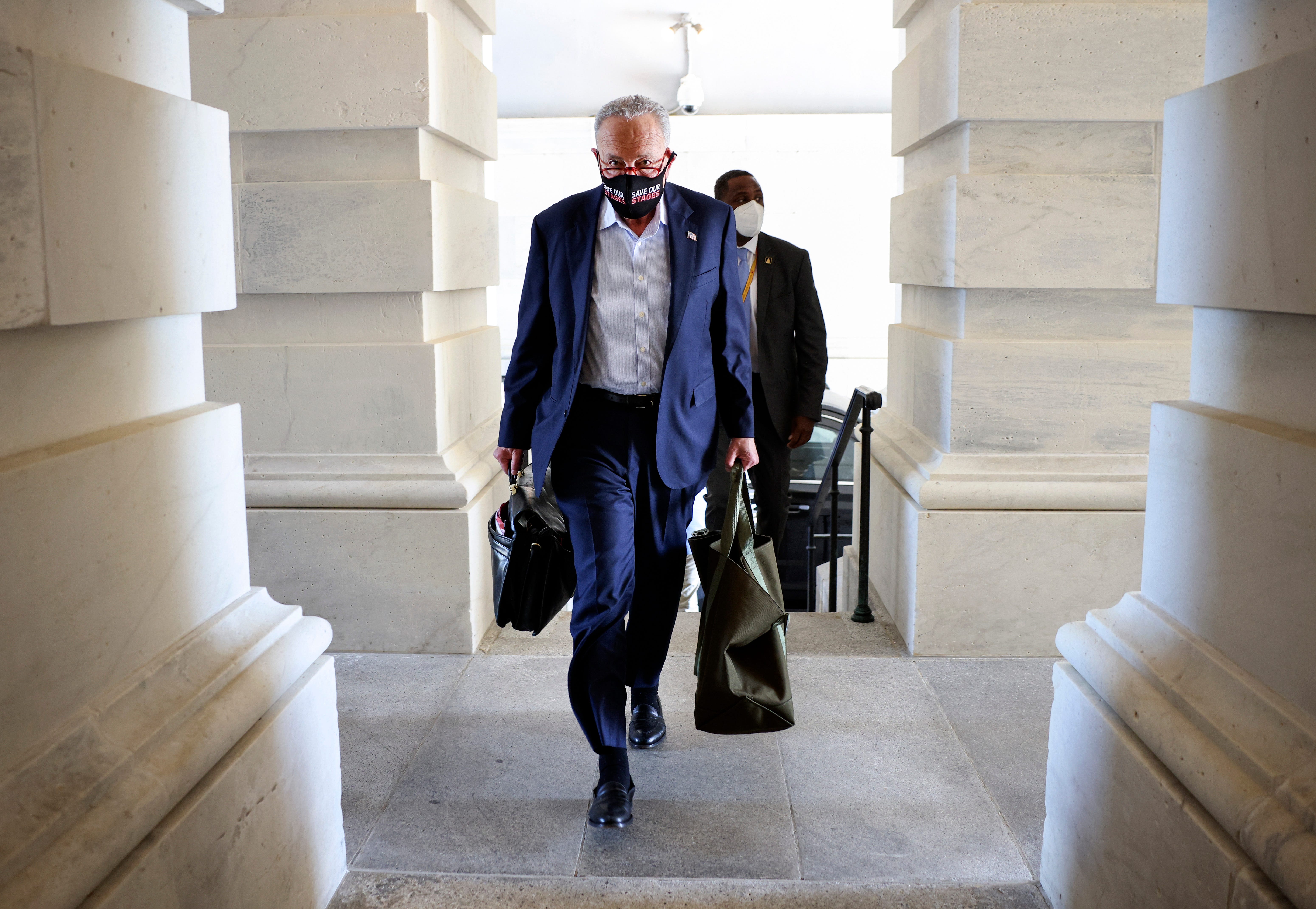 Senate Majority Leader Charles Schumer, D-N.Y., arrives at the U.S. Capitol on Sept. 27, 2021, in Washington. The Senate is working on passing a funding bill for the U.S. government and an increase to the debt ceiling before a possible government shutdown at the end of the week.