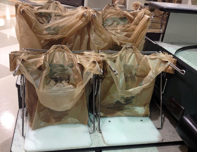 Plastic bags at the checkout counter of the grocery store.
