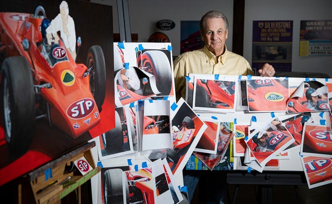 Gary Dausch is an Indianapolis artist who paints motorsports drivers and cars, seen Tuesday, Sept. 28, 2021, in the barn he converted into a workspace at his home. Dausch uses close-ups from photographs, such as those pictured at right, to be able to paint a car, person or scene with accurate detail.