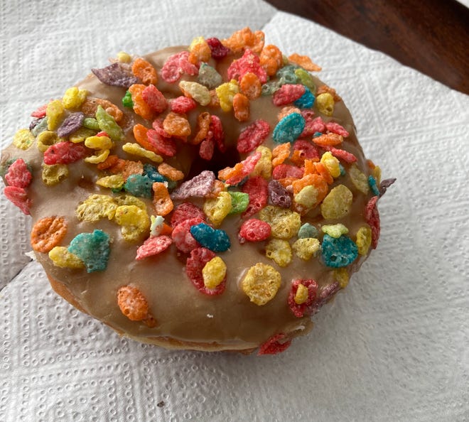 Maple-frosted donut with Fruity Pebbles, a $1 treat at Jelly Donut on Oddie Boulevard in Sparks.