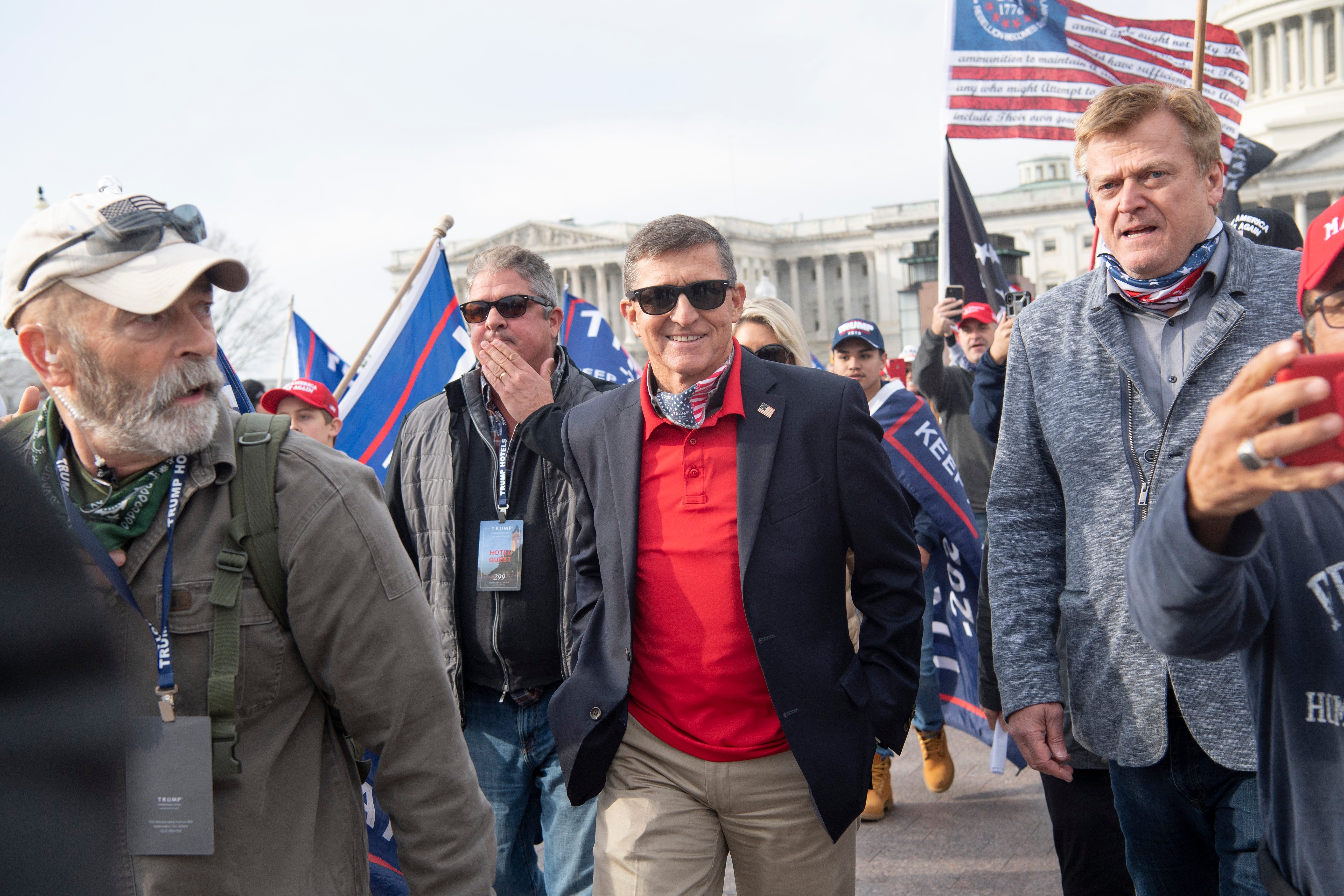 Patrick Byrne, former CEO of Overstock, seen on the right, stands at the front of the Supreme Court on Dec. 12, 2020, to speak to Donald Trump supporters protesting alleged voter fraud in the Nov. 3 presidential election, an unfounded claim also pushed by then-President Trump. Byrne had committed at least $1 million to Elio Motors in 2018, but his career soon unraveled after he admitted an affair with a Russian agent and financed a bid to overturn the election results.