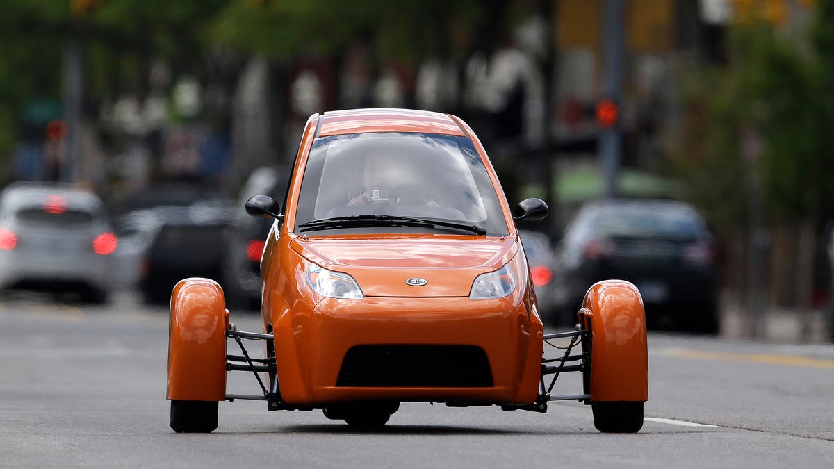 Since early 2013, Elio Motors has accumulated more than 65,000 deposits for its three-wheeled, two-seat, 84 mpg vehicle. But it has failed to deliver any vehicles. A prototype is seen here on the streets of Royal Oak, Michigan, in 2014.