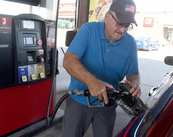 Jim Inbody pumps gas at a Columbia gas station last year. Missouri gas prices reached a record high Wednesday,