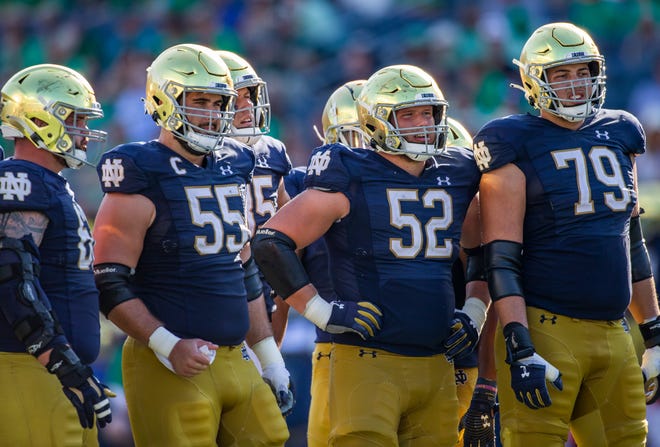 Notre Dame offensive linemen wait for the play call from their quarterback during the Notre Dame-Purdue game on Saturday, Sept. 18, 2021, at Notre Dame Stadium.