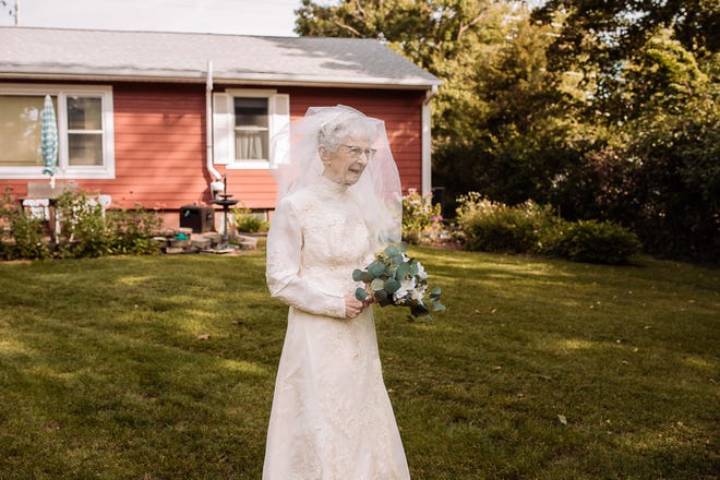 Frankie King, 96, walks down the aisle toward her groom, Royce King, in a recreation of their wedding to celebrate their 77th anniversary.