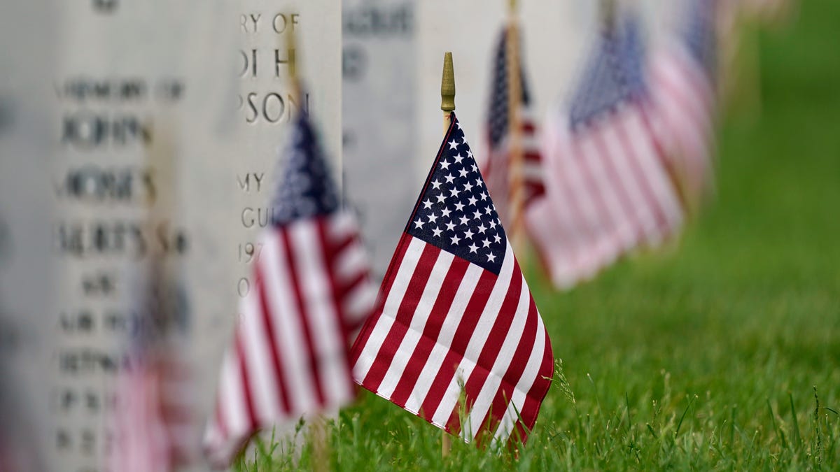 Flags mark gravestones at  Fort Logan National Cemetery in Denver on May 31, 2021. The number of U.S. military suicides jumped by 15% last year, fueled by significant increases in the Army and Marine Corps that senior leaders called troubling.
