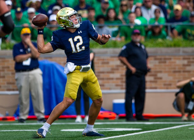 Notre Dame’s Tyler Buchner (12) throws the ball during the Notre Dame vs. Cincinnati NCAA football game Saturday, Oct. 2, 2021 at Notre Dame Stadium in South Bend.
