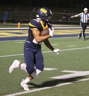 Mooresville senior Gideon Brimmage has running room on a kickoff return during the game against Decatur Central. Brimmage was dominant in the game against Jennings County, scoring on two kickoff returns and a rushing TD in a quarter and a half.