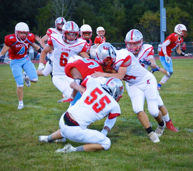 Elgin's defense makes a stop during last year's football game at Ridgedale. The two Marion County teams will face each other Friday night at Elgin.