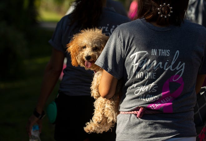 Lilly the dog tag together with her owner during the “Making Strides Against Breast Cancer Walk” on Saturday, October 2nd, 2021, in the North Collier Regional Park in Naples.